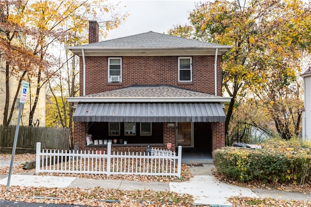 view of front property featuring covered porch