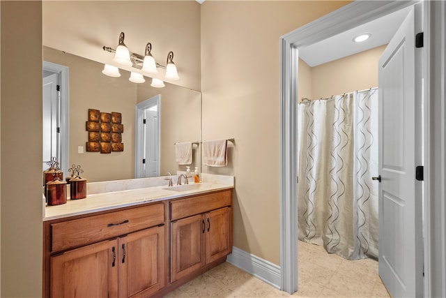 bathroom featuring tile patterned flooring and vanity