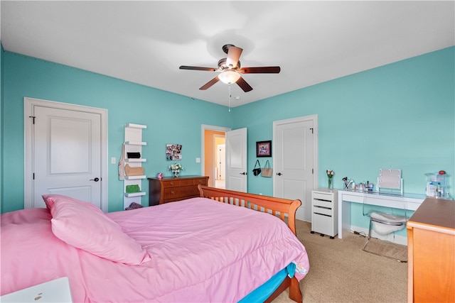 carpeted bedroom featuring ceiling fan