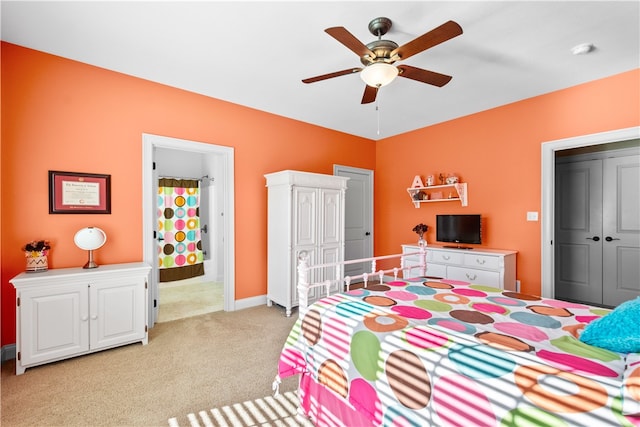 bedroom with a closet, light carpet, and ceiling fan