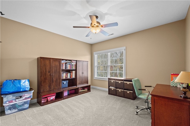 carpeted office with ceiling fan