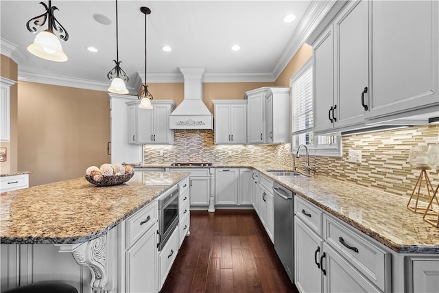 kitchen featuring dark hardwood / wood-style flooring, a kitchen island, sink, and premium range hood