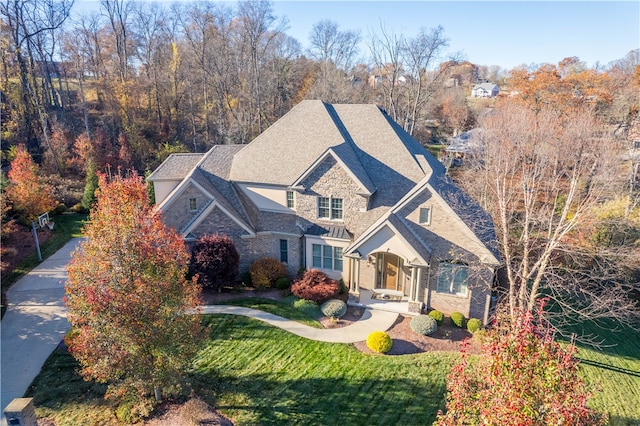 view of front of property featuring a front yard and covered porch