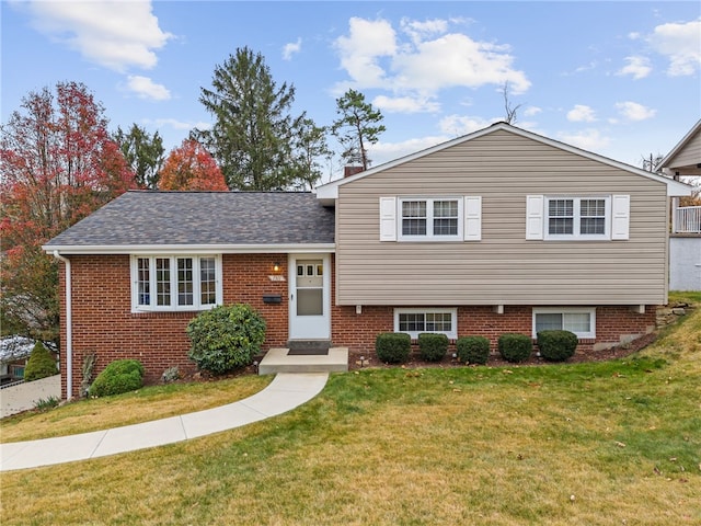 tri-level home featuring a front yard