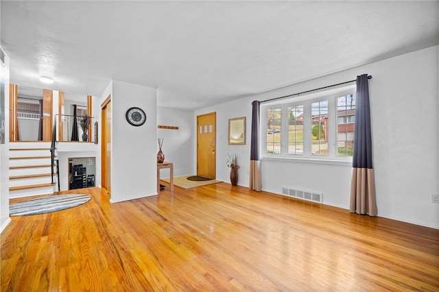 unfurnished living room featuring light wood-type flooring