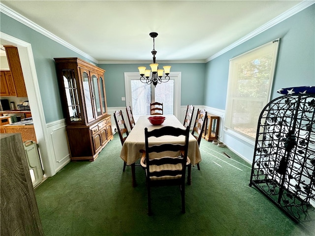 dining space featuring carpet, a notable chandelier, and crown molding