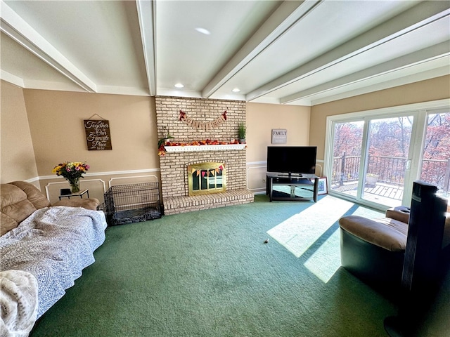 living room with beamed ceiling, carpet floors, and a brick fireplace