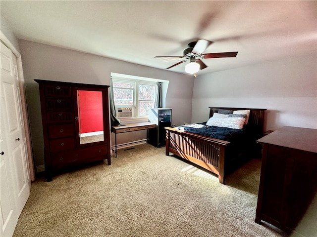 bedroom featuring ceiling fan, light colored carpet, and a closet