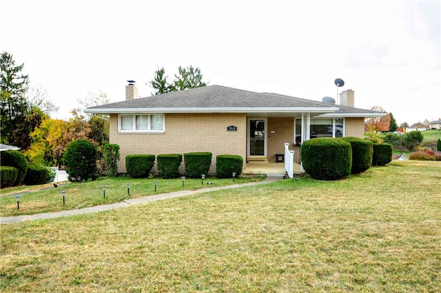 view of front of home featuring a front yard