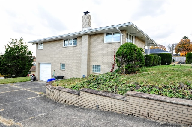 view of side of home featuring a garage