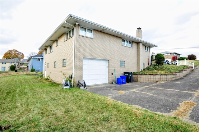 view of side of property with a garage