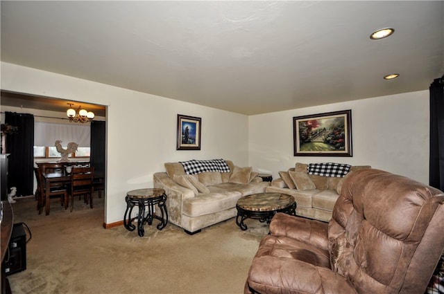 living room featuring carpet flooring and a chandelier