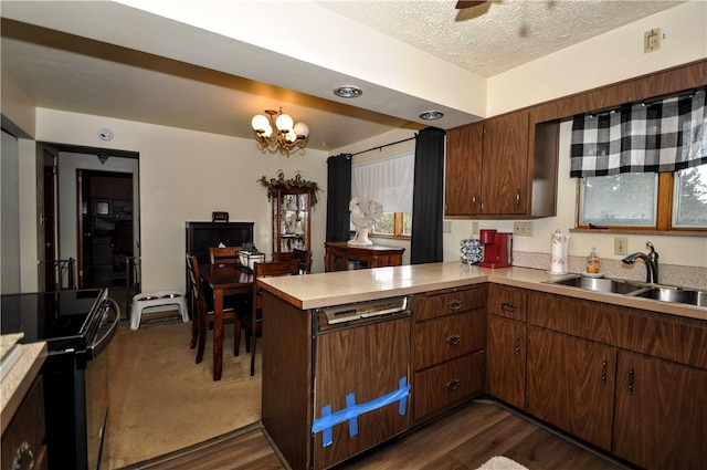 kitchen featuring kitchen peninsula, a textured ceiling, sink, dark wood-type flooring, and black range with electric stovetop