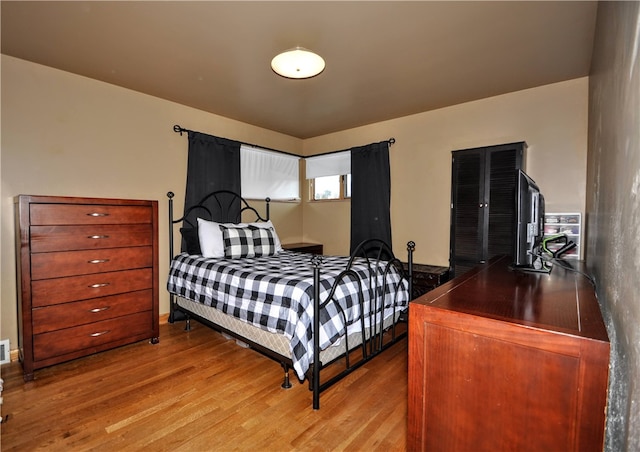 bedroom with light wood-type flooring