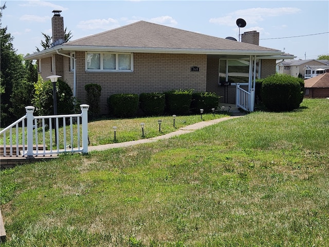 view of front of home with a front lawn