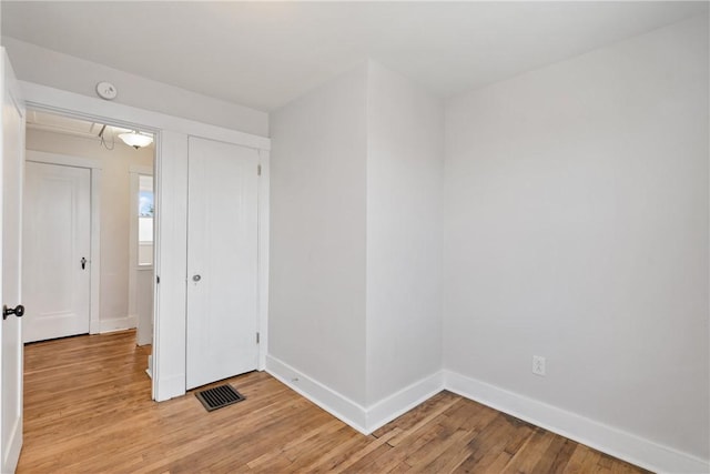 spare room featuring light hardwood / wood-style flooring