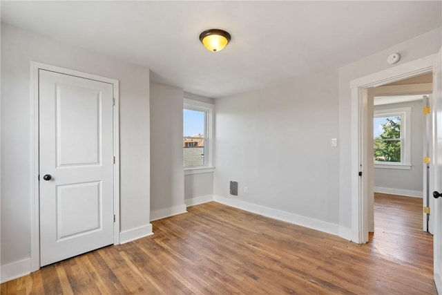 unfurnished bedroom featuring hardwood / wood-style floors