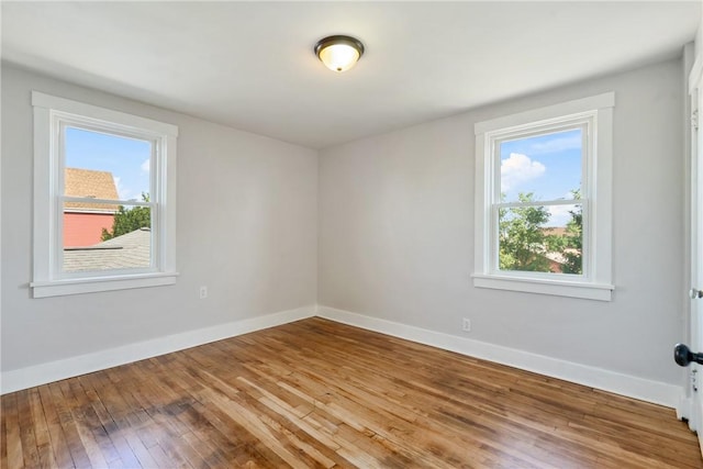 spare room featuring hardwood / wood-style floors