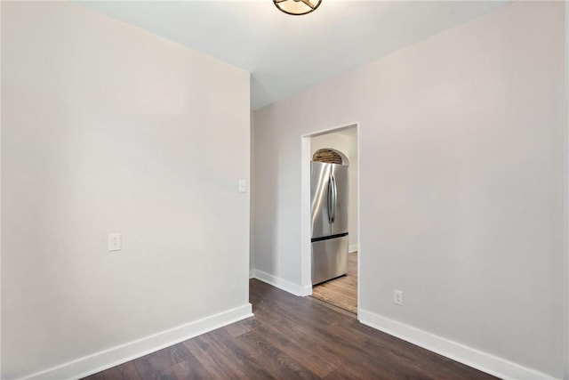 empty room with dark wood-type flooring