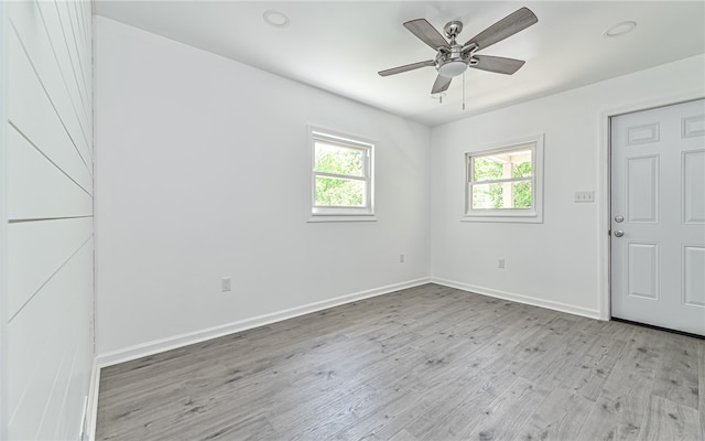 unfurnished room with ceiling fan and light hardwood / wood-style floors