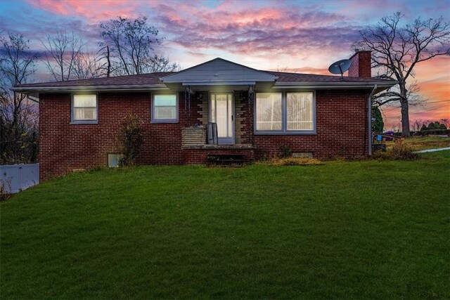 view of front of house with a yard