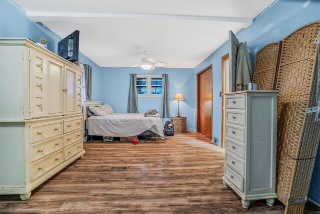 bedroom featuring hardwood / wood-style flooring and ceiling fan