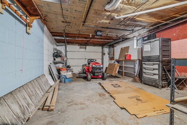 garage with electric panel and a garage door opener