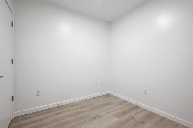 spare room featuring light wood-type flooring