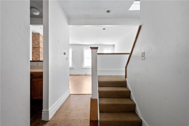 stairway featuring hardwood / wood-style flooring