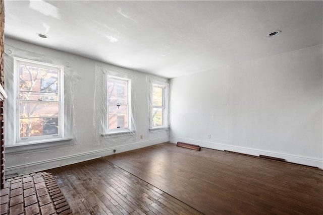 spare room featuring dark hardwood / wood-style floors