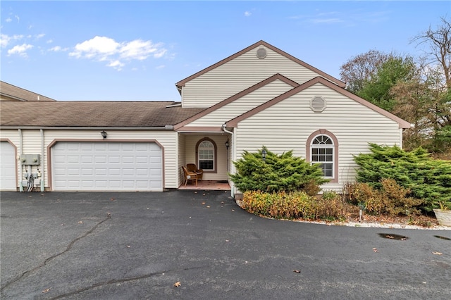 front facade with a garage