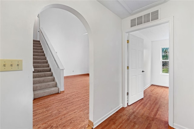 corridor with light wood-type flooring