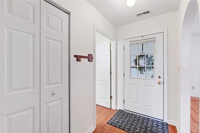 doorway to outside with light wood-type flooring