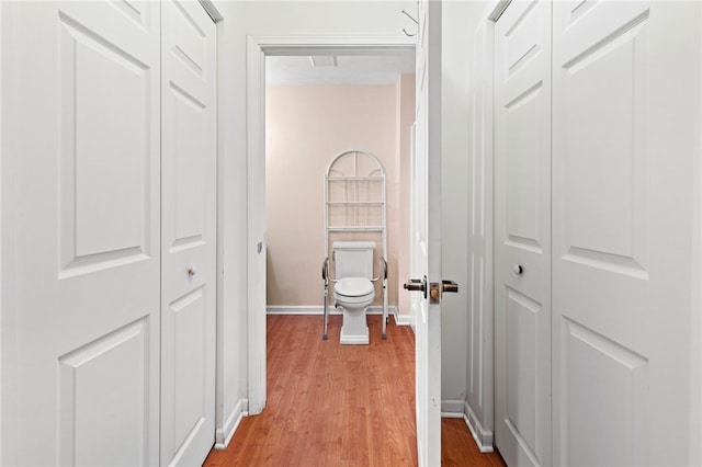 hallway featuring light hardwood / wood-style flooring