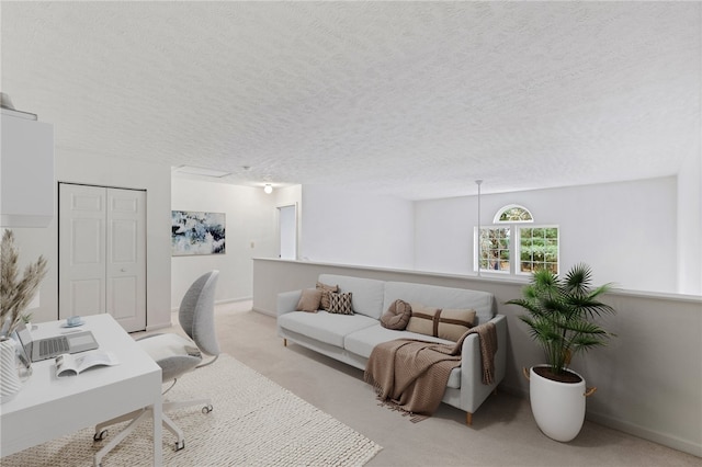 carpeted home office with a textured ceiling