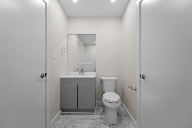 bathroom with toilet and vanity