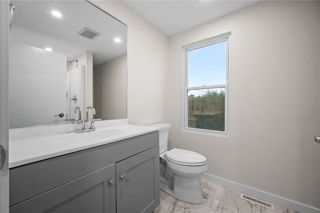 bathroom with toilet and vanity