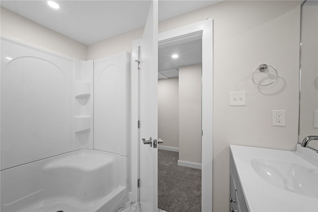 bathroom featuring vanity and a shower