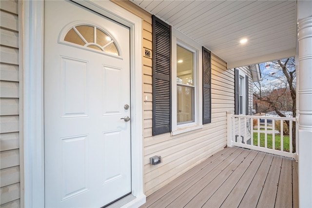 view of exterior entry featuring a porch