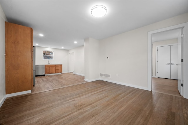 unfurnished living room featuring light hardwood / wood-style flooring