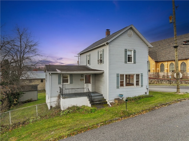 view of front of property with a lawn