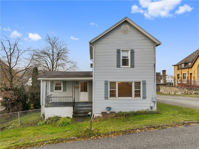 front of property with a porch and a front lawn