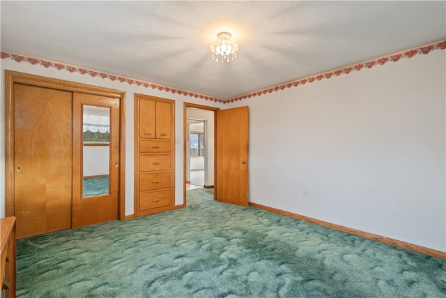 unfurnished bedroom featuring carpet and a closet