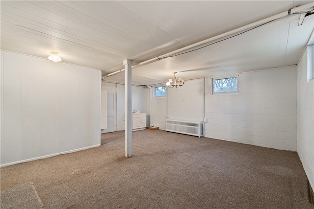 basement with carpet and radiator