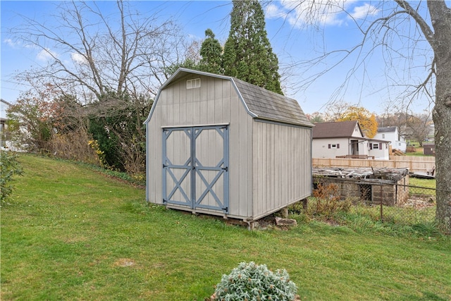 view of outbuilding with a lawn