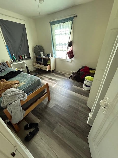 bedroom featuring dark wood-type flooring