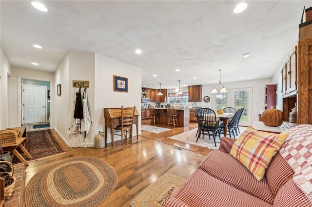 living room with light hardwood / wood-style floors