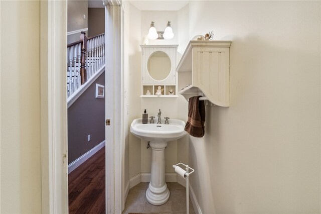 bathroom with hardwood / wood-style flooring