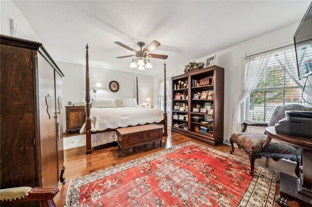 bedroom featuring hardwood / wood-style floors and ceiling fan