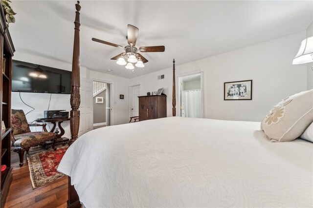 bedroom with dark wood-type flooring and ceiling fan